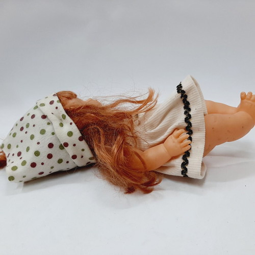 Vintage plastic doll 60s with open eyes, white knitted dress, tiara
