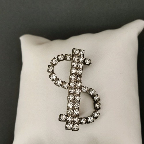 Dollar brooch like new with stones