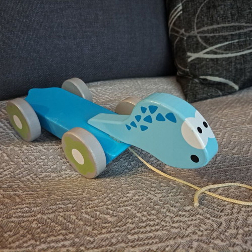 Wooden Dinosaur Pull Toy by J'adore like new, blue with floral wheels