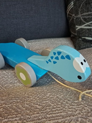 Wooden Dinosaur Pull Toy by J'adore like new, blue with floral wheels