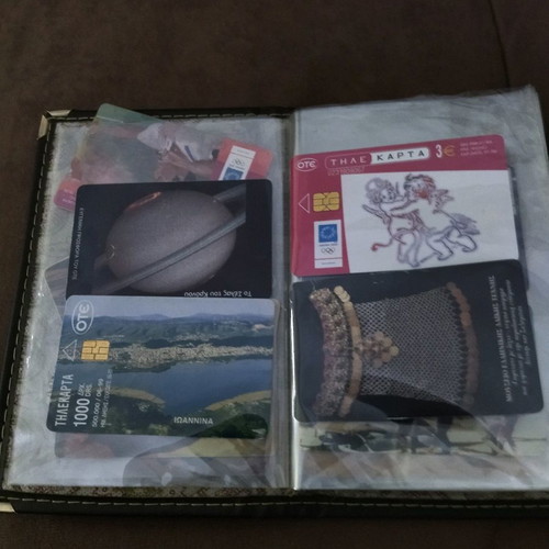 Collectible old phone cards used with album