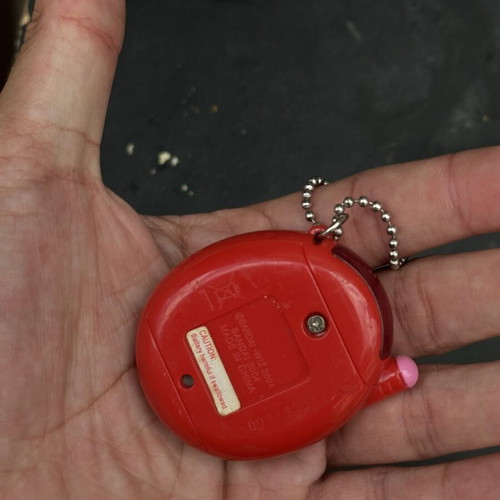 Vintage Tamagotchi Bandai 2004 red tropical design electronic keychain used