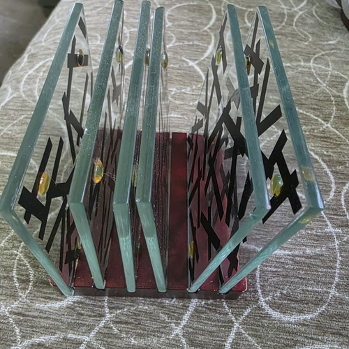 Glass coasters with beautiful designs on wooden base like new