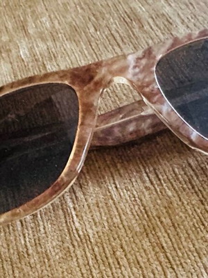 Brown marble sunglasses with dark lenses