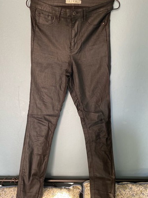 Elastic black pants with leather texture used