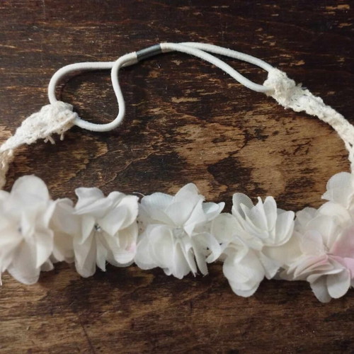 White hair ribbon wreath used for flower girl with flowers