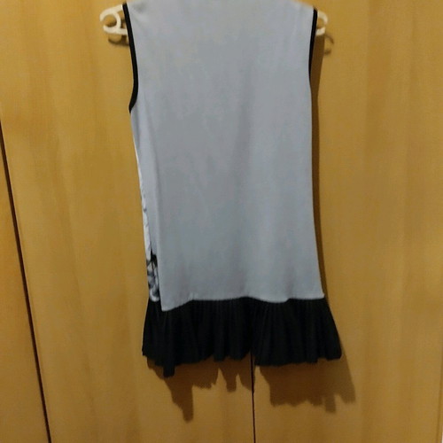 Children's sleeveless dress with pleated hem like new