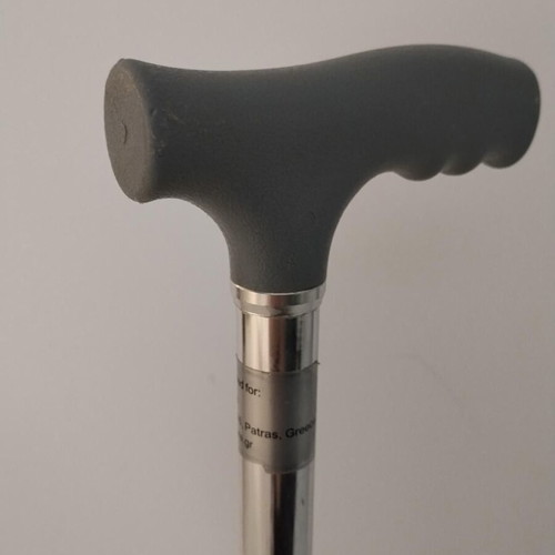Four-legged walking stick with gray handle like new