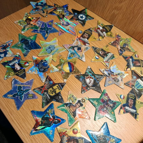 Set of 31 used metal star-shaped tags