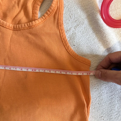 Girls' sports set with grey leggings and orange tank top, size 10