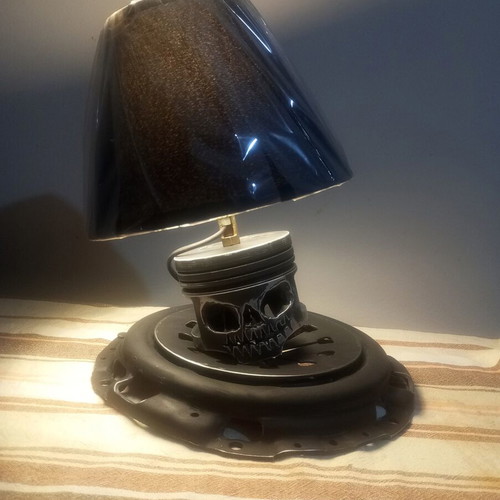 Handmade desk lamp with piston and clutch plate in deep black mat