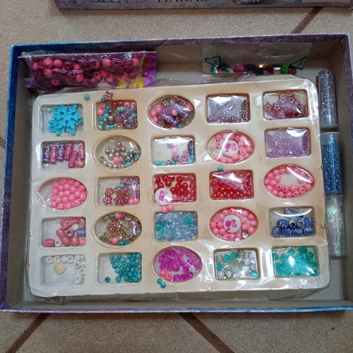 Frozen craft set used, includes beads, rhinestones, and glitter
