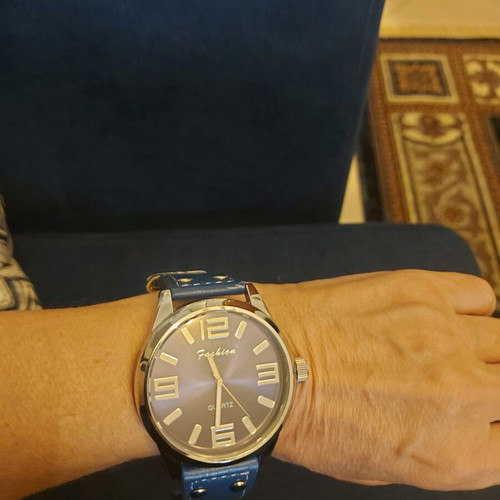 Women's watch like new with blue strap and metal case