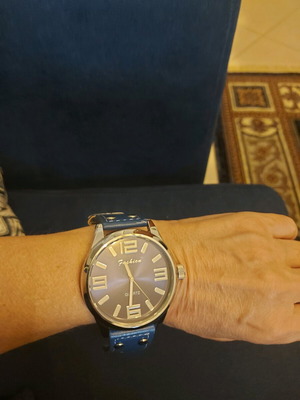 Women's watch like new with blue strap and metal case