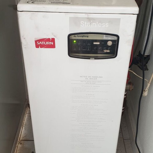 Saturn oil burner with 500 litre oil tank and metal enclosure
