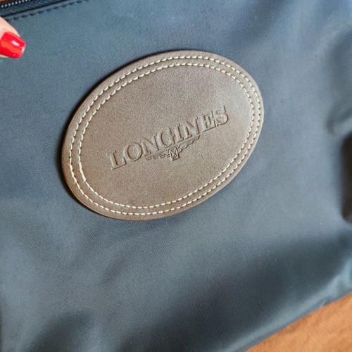 Longines purse used handheld 100% original