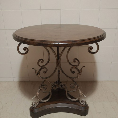 Round wooden table with metal leg, vintage style