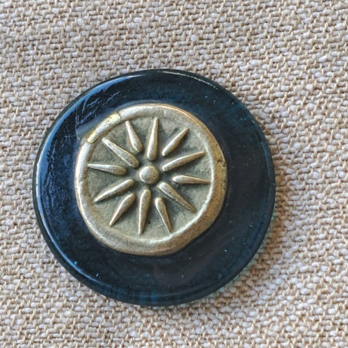 Paperweight with Vergina Star used, brass on glass base