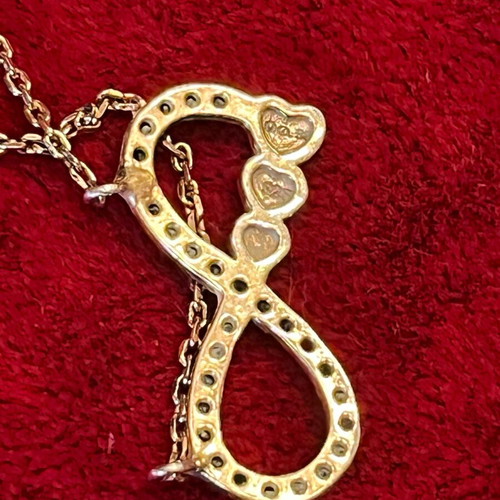 Silver 925 necklace with gold vermeil coating, infinity design with gold hearts, used