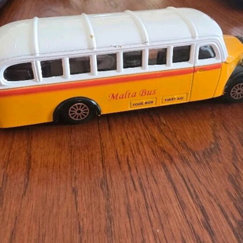 Collectible toy cars used, London Taxi and Valletta bus