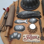 Collection of vintage pastry tools on wooden board