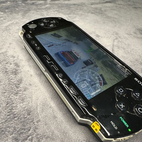 PlayStation Portable PSP-1000 used with charger, 5 games, and Memory Stick