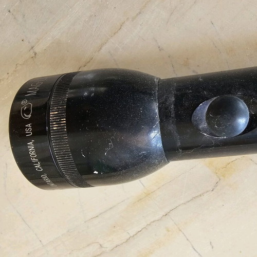 Flashlight used with swollen battery