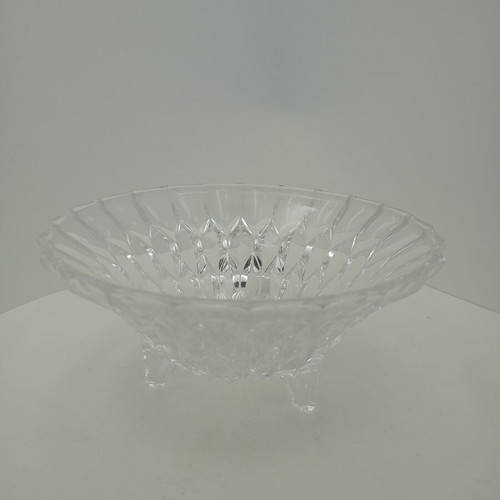Vintage crystal bowl with intricate cut designs on three elegant legs