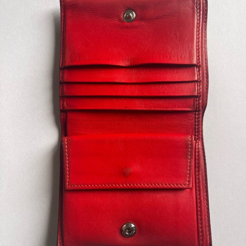 Christian Louboutin wallet used with missing spike and black stains