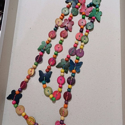 Wooden very long necklace with butterflies used