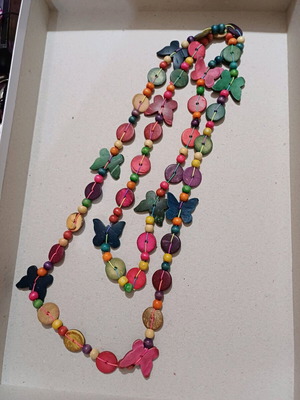 Wooden very long necklace with butterflies used