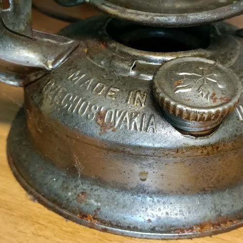Vintage storm lantern used with cracked glass