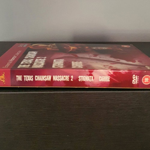 Essential Horror Collection Box Set used DVD with The Texas Chainsaw Massacre 2, Stigmata, Carrie