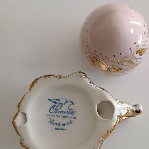 Porcelain egg like new, pink with gold details and stand