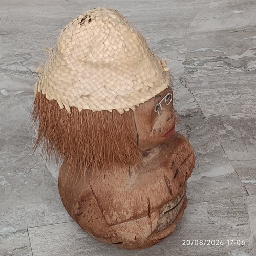 Handmade coconut shell money box with straw hat