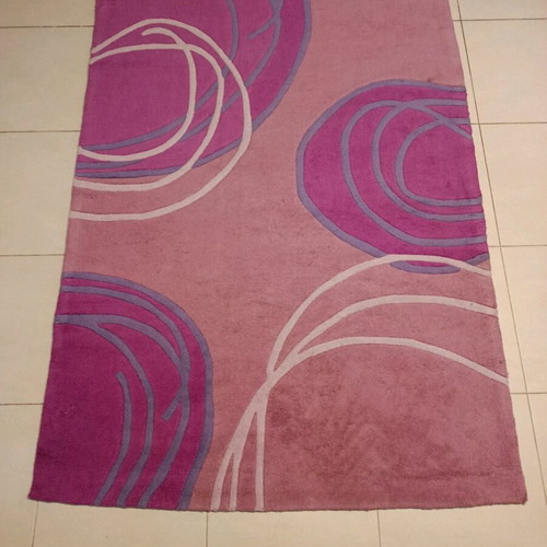 Children's rug used in pink fuchsia and purple with circular patterns