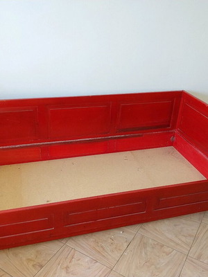 Red sofa used with storage space