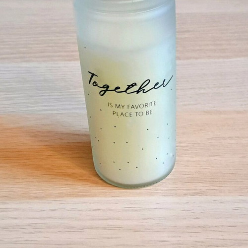White candle in container new