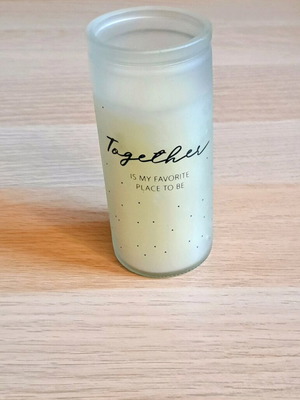 White candle in container new
