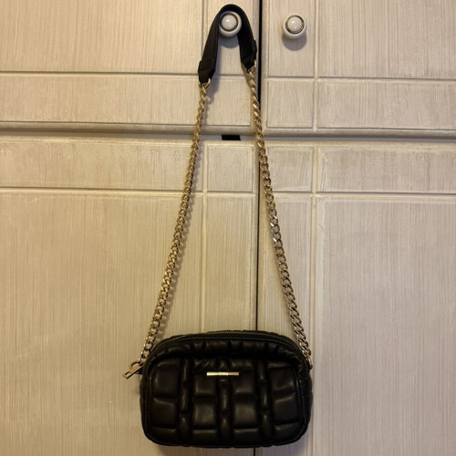 Women's black crossbody bag with gold chain