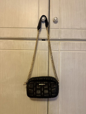 Women's black crossbody bag with gold chain
