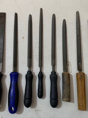 Metal files used, triangular, flat and round