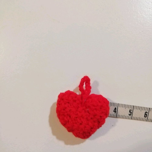 Knitted hanging red hearts like new