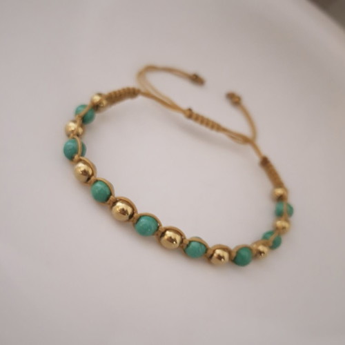 Handmade macrame bracelet with green and gold beads, adjustable