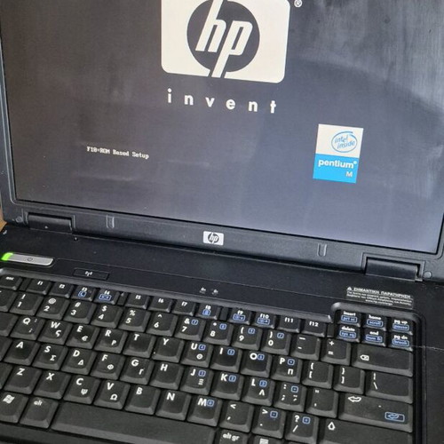 HP Compaq NX6110 laptop used without hard drive, battery, and charger