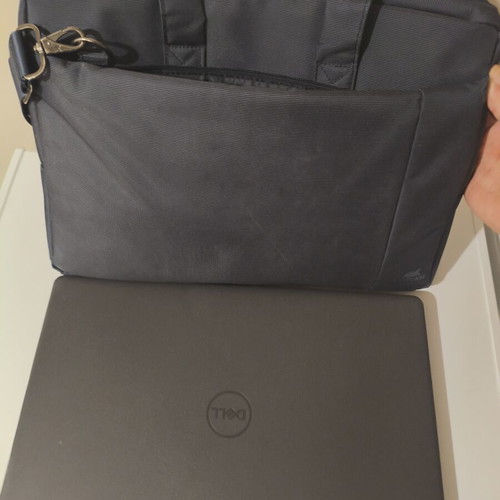 Dell Vostro 15 3000 laptop with 8GB RAM, charger, mouse, and case