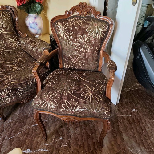 Classic living room refurbished with sofa, armchairs, chairs and marble tables