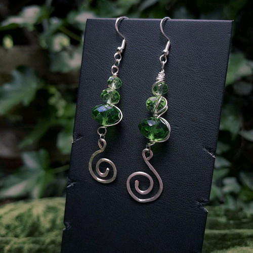 Earrings with green crystals and spiral charms new, silver