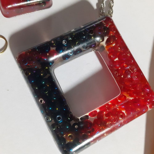 Two sets of handmade pendants and earrings, multicolor