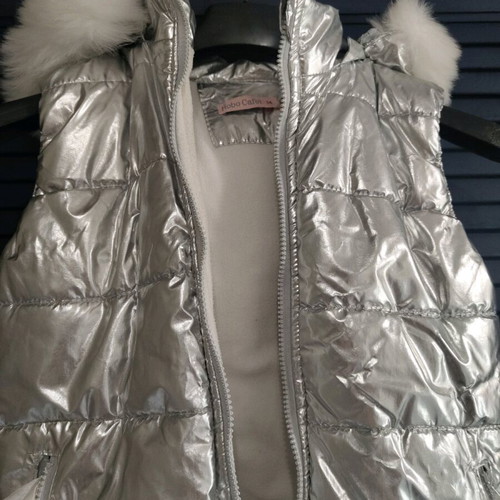 Silver sleeveless jacket used for girls aged 9-11 years